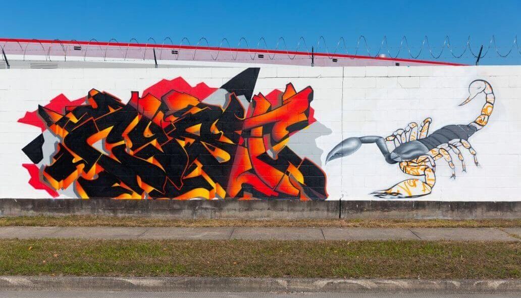 Multi-colored mural along the outer wall of the Kashmere bus operating facility at 5700 Eastex Freeway in Houston